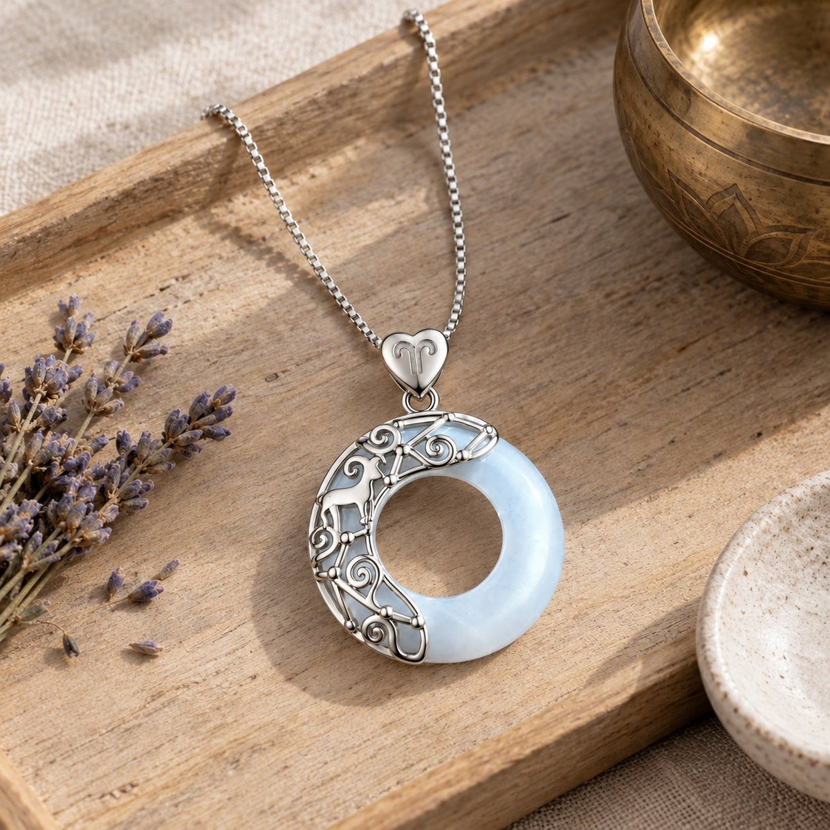 925 Sterling Silver Cat's Eye Zodiac Necklace for Love Support, styled with a singing bowl and lavender
