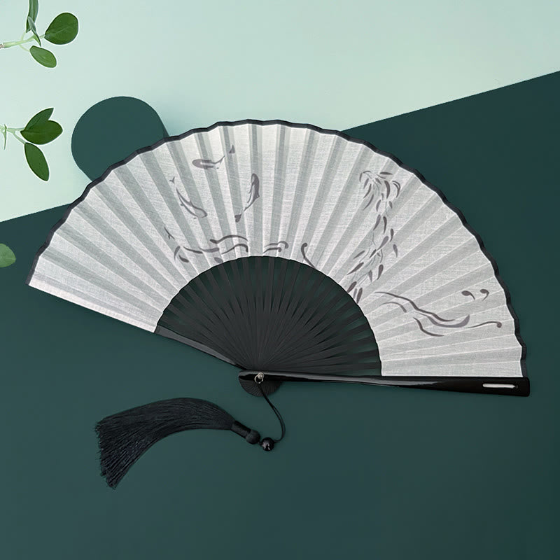 Éventail chinois pliable à motifs de bambou et de carpes koï