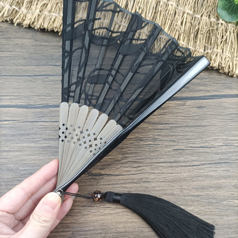 Éventail chinois pliable rétro en bambou et soie avec feuilles et fleurs