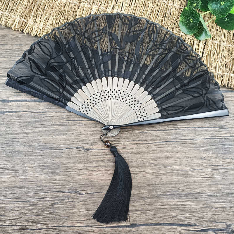 Éventail chinois pliable rétro en bambou et soie avec feuilles et fleurs