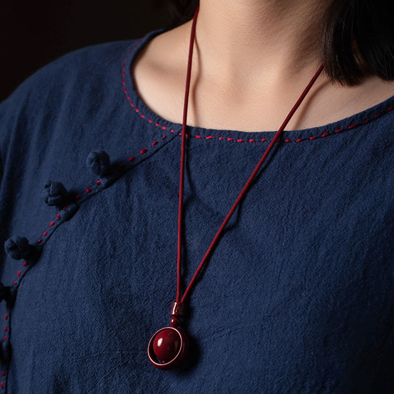Collier Om Mani Padme Hum en cinabre pour la bénédiction et la chance