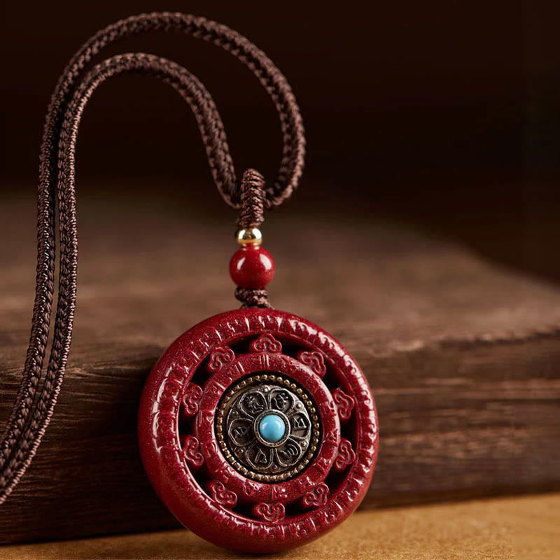 Collier pendentif rotatif et porte-clés Cinabre Om Mani Padme Hum