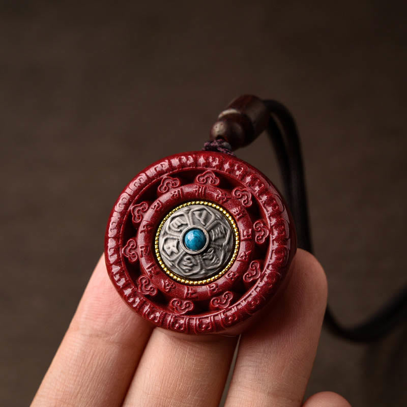 Collier pendentif rotatif et porte-clés Cinabre Om Mani Padme Hum