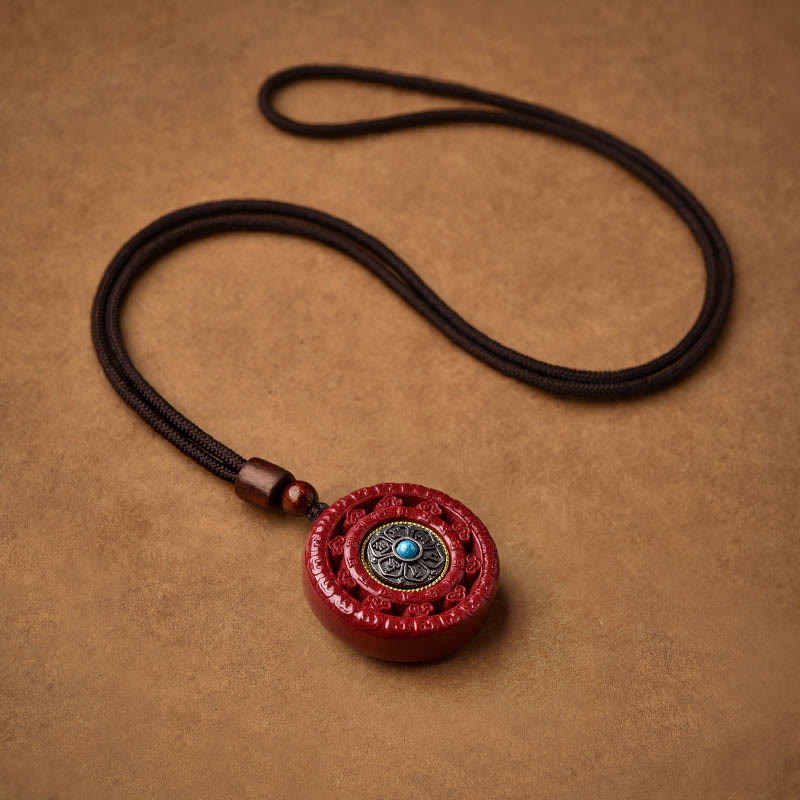 Collier pendentif rotatif et porte-clés Cinabre Om Mani Padme Hum
