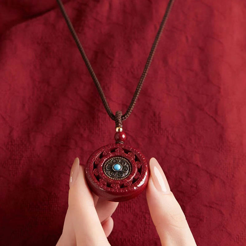 Collier pendentif rotatif et porte-clés Cinabre Om Mani Padme Hum