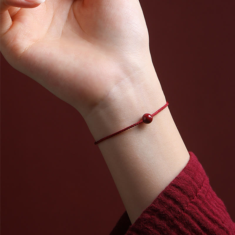 Bracelet de bénédiction en fil rouge cinabre et agate rouge