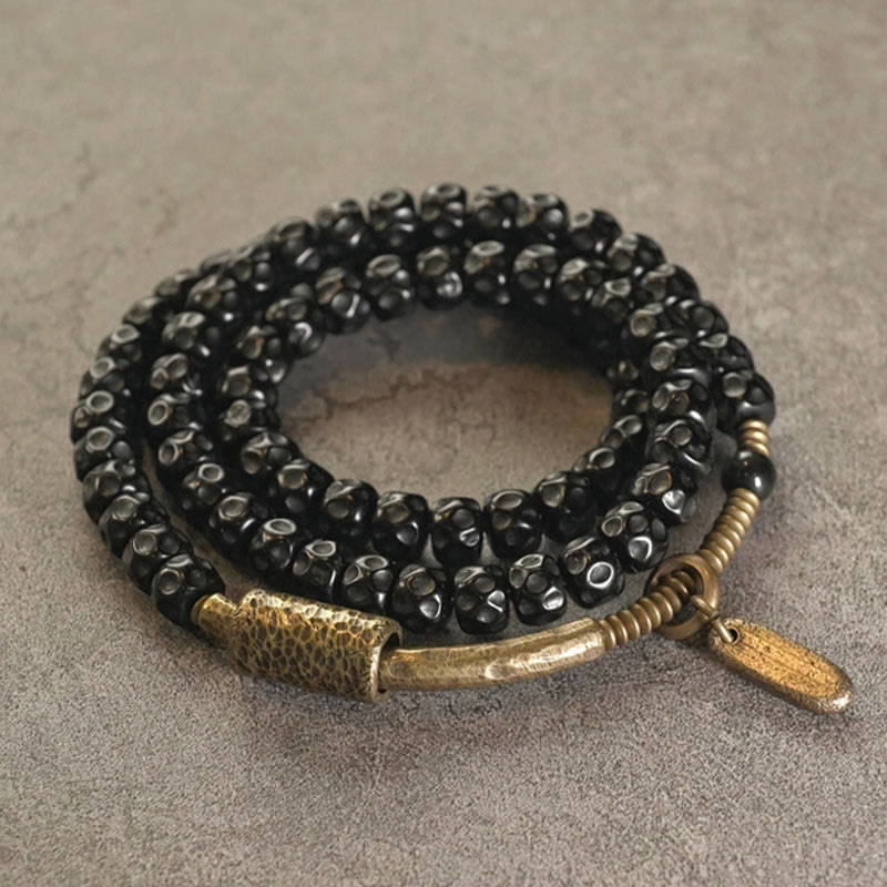 Bracelet spirituel triple tour en cuivre et coquille de noix de coco