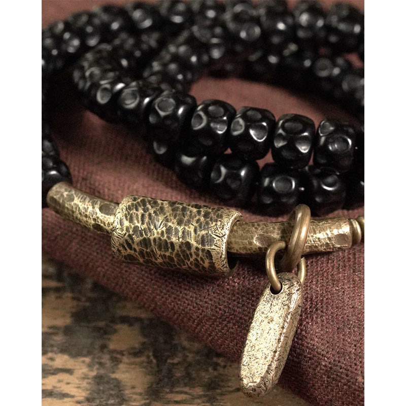 Bracelet spirituel triple tour en cuivre et coquille de noix de coco