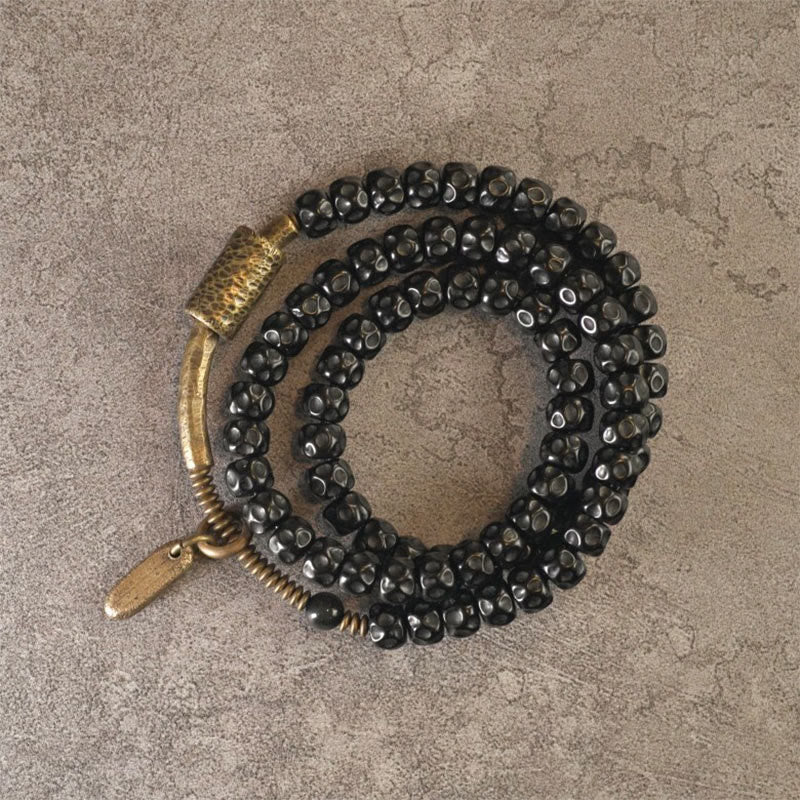 Bracelet spirituel triple tour en cuivre et coquille de noix de coco