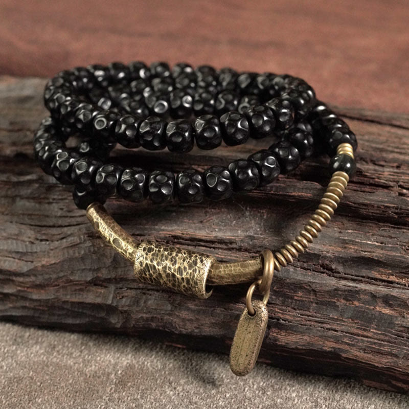 Bracelet spirituel triple tour en cuivre et coquille de noix de coco