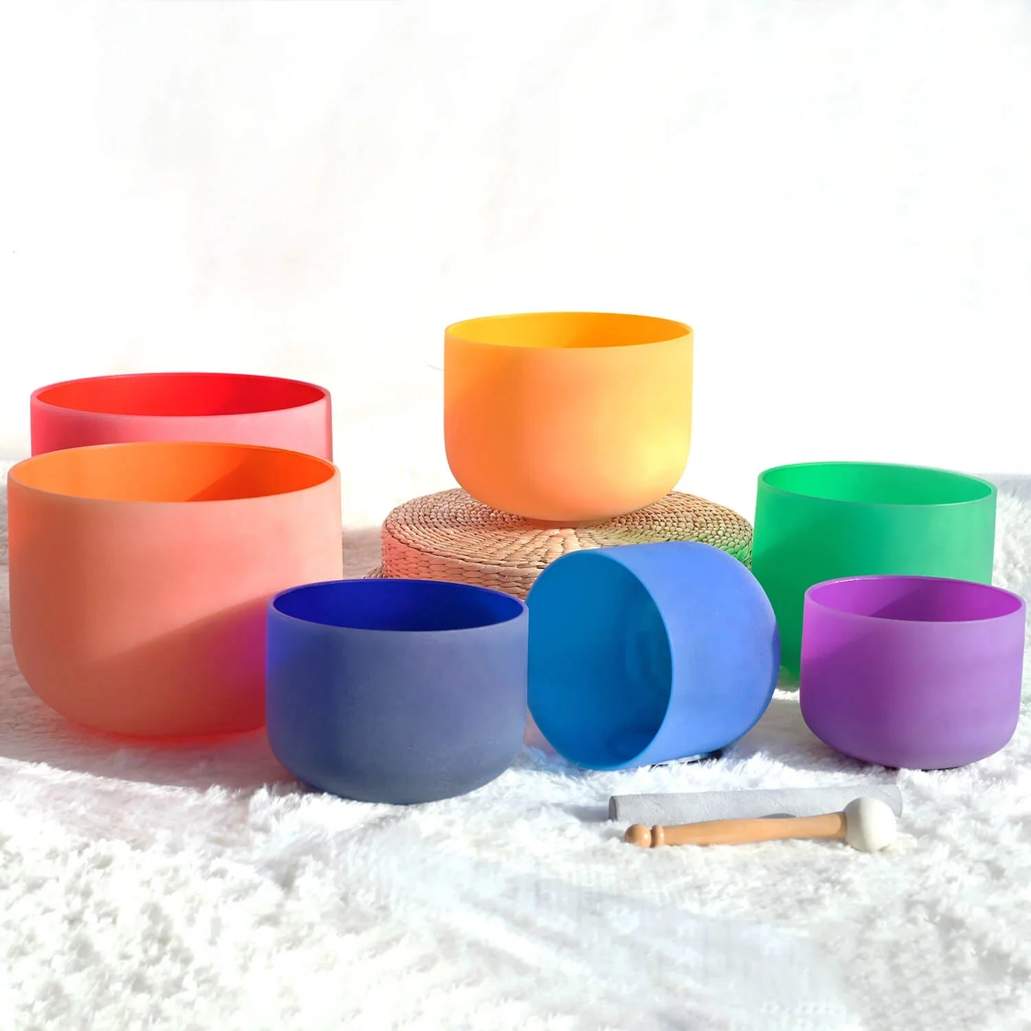 Colorful Chakra Crystal Singing Bowl Set arranged in a rainbow spectrum of 7 bowls