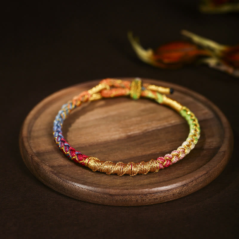 Bracelet en fil d'or coloré avec nœud en écailles de dragon tibétain et cordon rouge