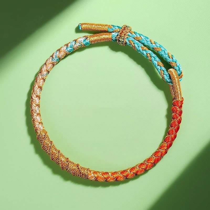 Bracelet en fil d'or coloré avec nœud en écailles de dragon tibétain et cordon rouge
