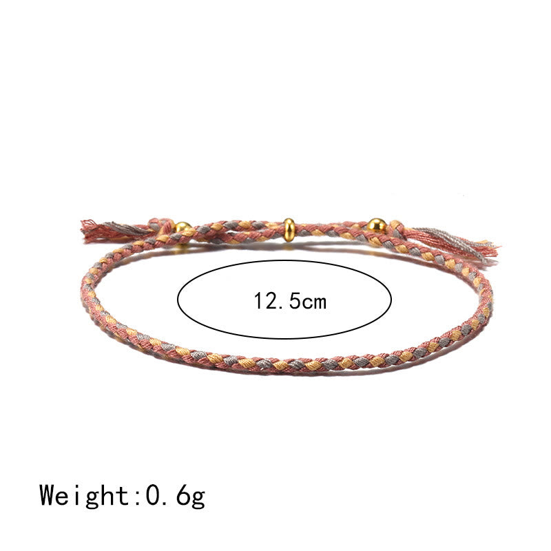 Bracelet d'harmonie coloré fait main avec pompon en corde réglable