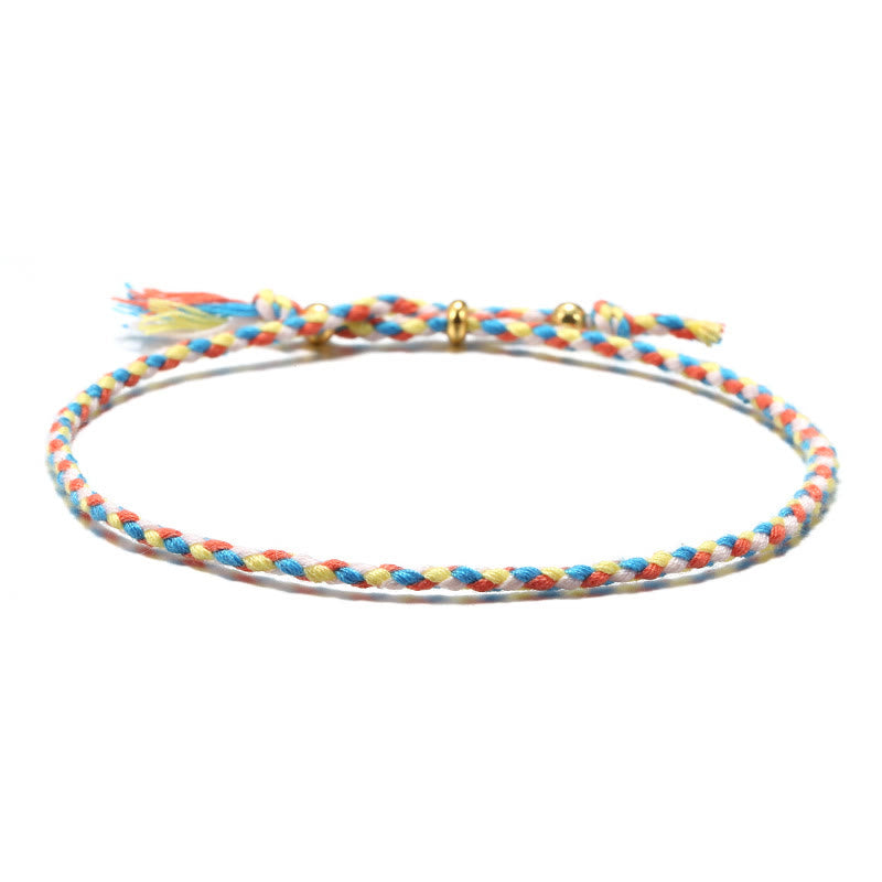 Bracelet d'harmonie coloré fait main avec pompon en corde réglable