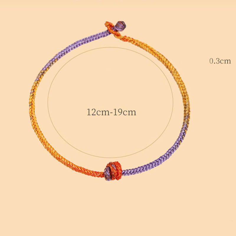 Bracelet en corde tressée colorée violette, dorée et rouge pour l'équilibre
