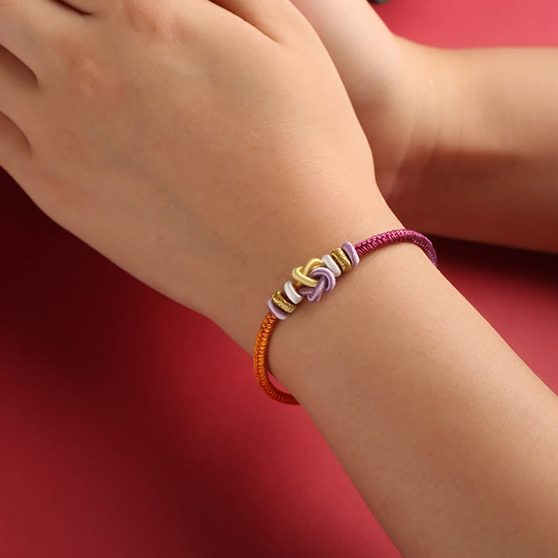 Bracelet de protection spirituel réglable en corde colorée avec nœud en forme de cœur