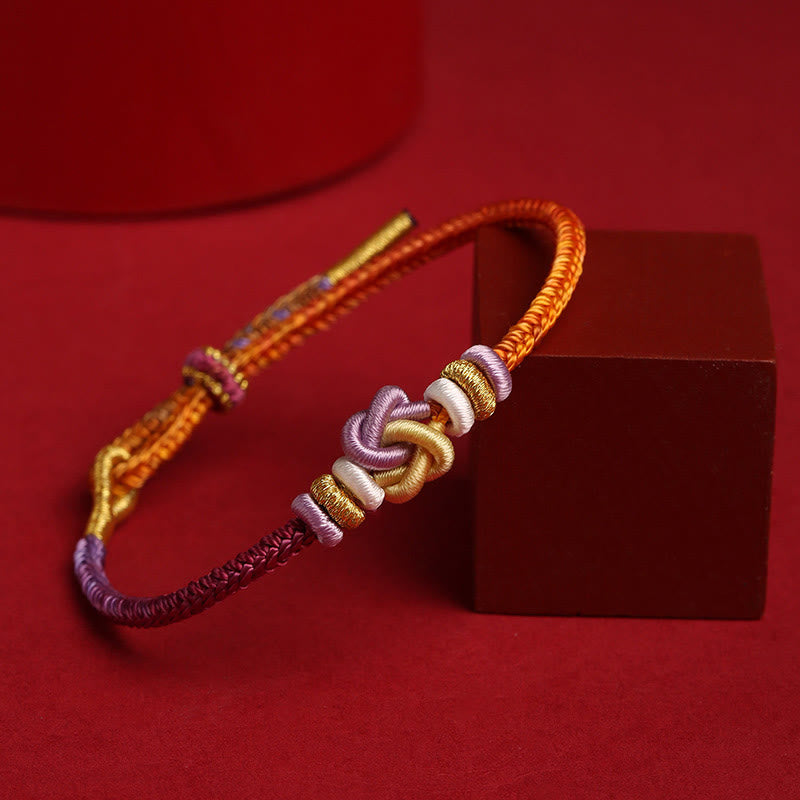 Bracelet de protection spirituel réglable en corde colorée avec nœud en forme de cœur