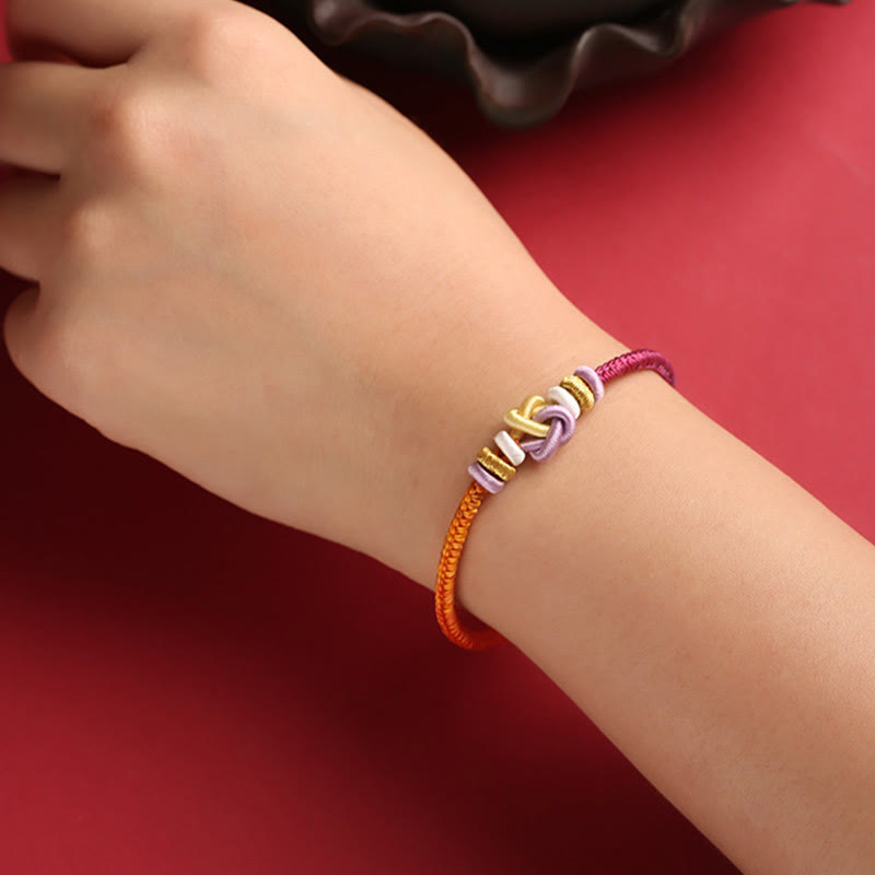 Bracelet de protection spirituel réglable en corde colorée avec nœud en forme de cœur