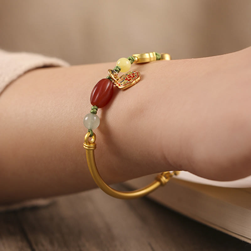 Bracelet de richesse en cuivre avec nuages ​​de bon augure pour la chance et la prospérité