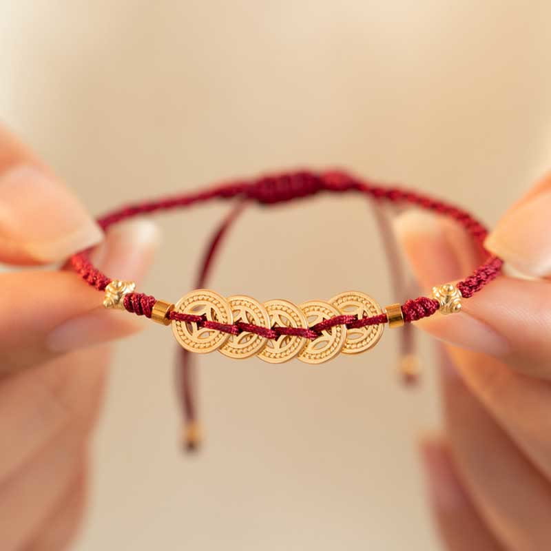 Bracelet en fil rouge avec pièce de cuivre pour la chance et la protection