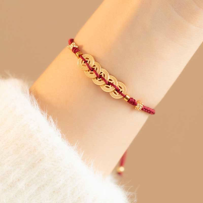 Bracelet en fil rouge avec pièce de cuivre pour la chance et la protection