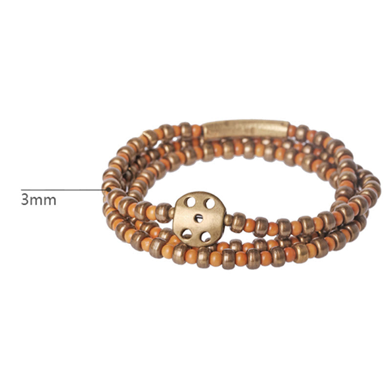 Bracelet spirituel en noyau d'olive en cuivre pour la richesse et l'équilibre