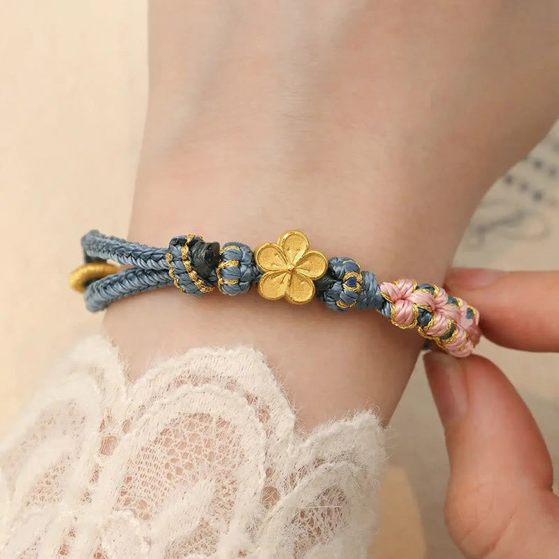 Bracelet de richesse en cuivre et fleur de pêcher pour l'équilibre