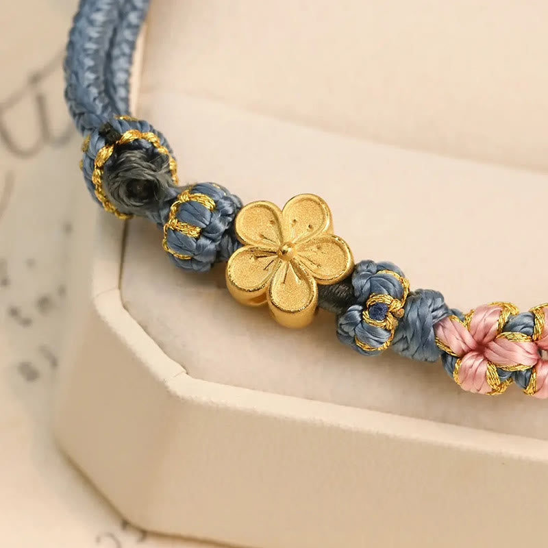 Bracelet de richesse en cuivre et fleur de pêcher pour l'équilibre