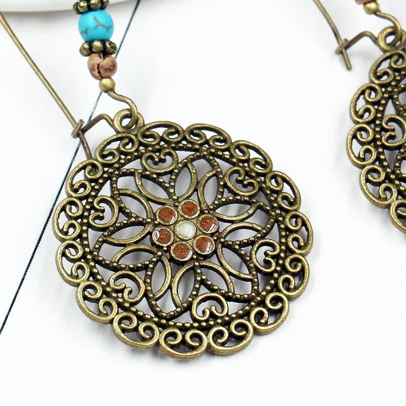 Boucles d'oreilles spirituelles en cuivre avec motif floral pour la chance et l'abondance