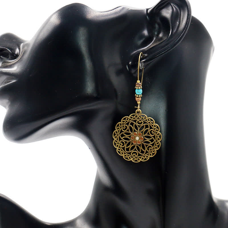 Boucles d'oreilles spirituelles en cuivre avec motif floral pour la chance et l'abondance