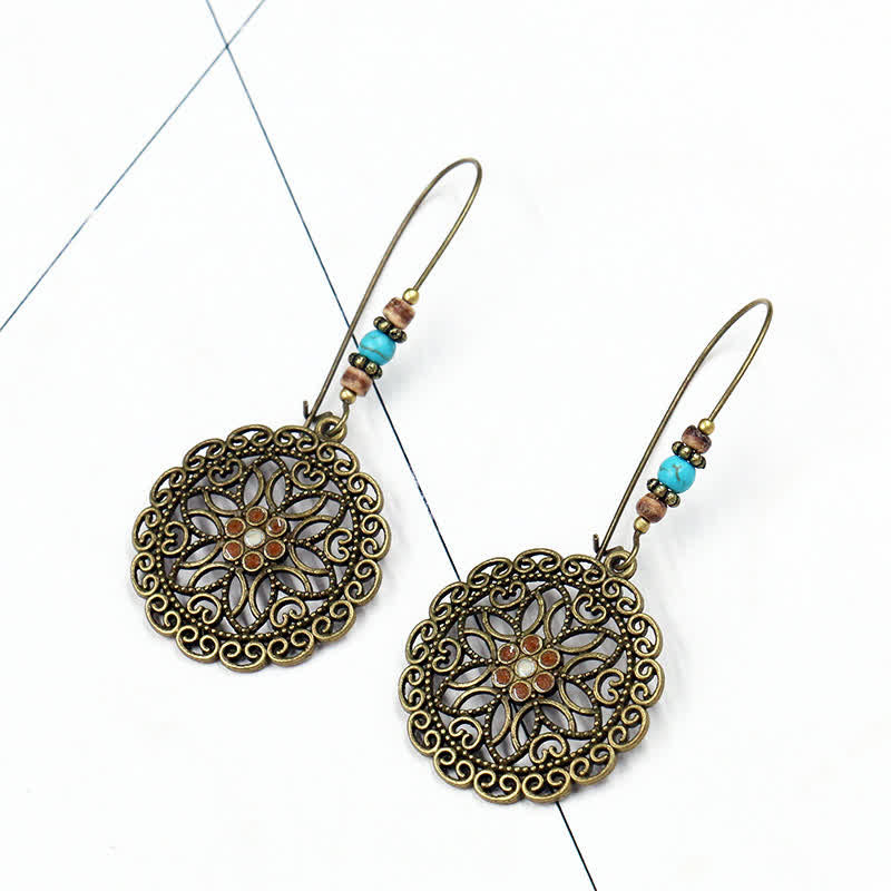 Boucles d'oreilles spirituelles en cuivre avec motif floral pour la chance et l'abondance