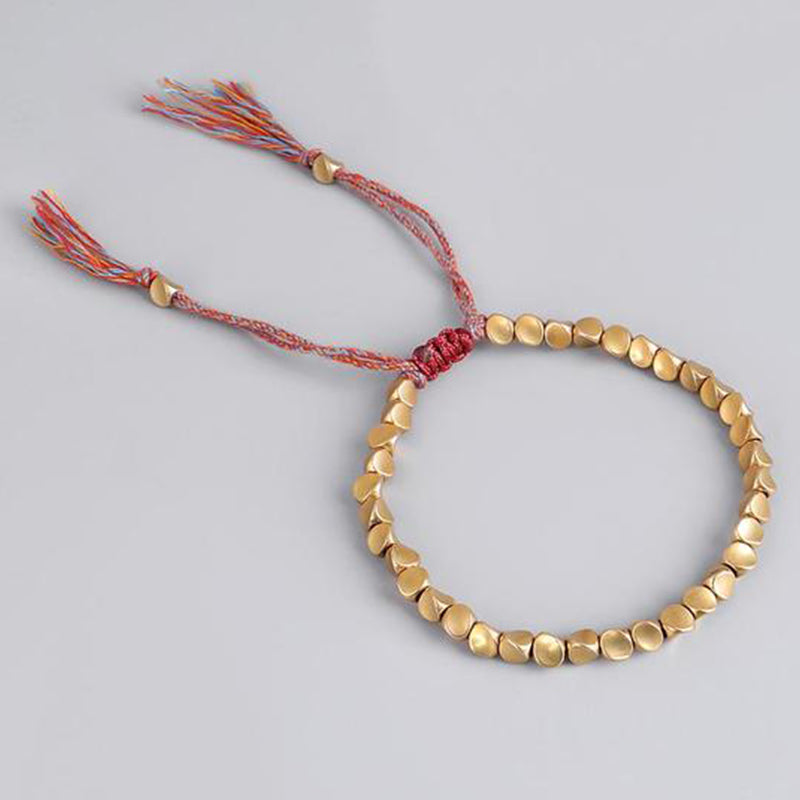 Bracelet tibétain porte-bonheur en cuivre avec perles colorées