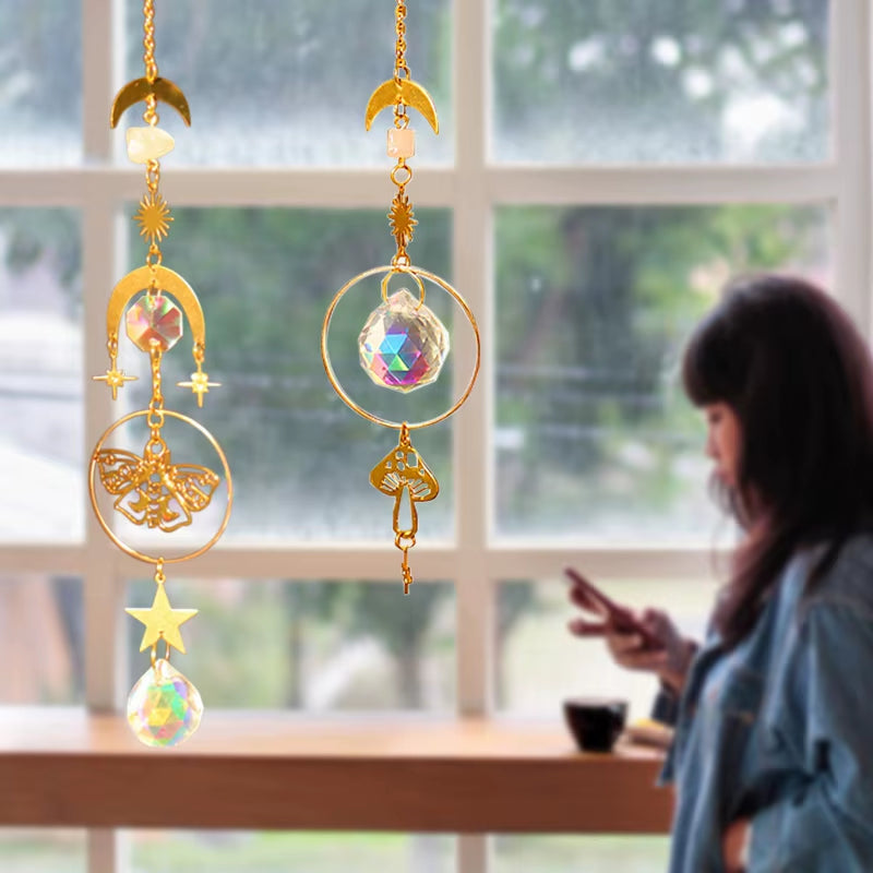Golden sun and moon suncatchers with crystals, perfect for outdoor decor