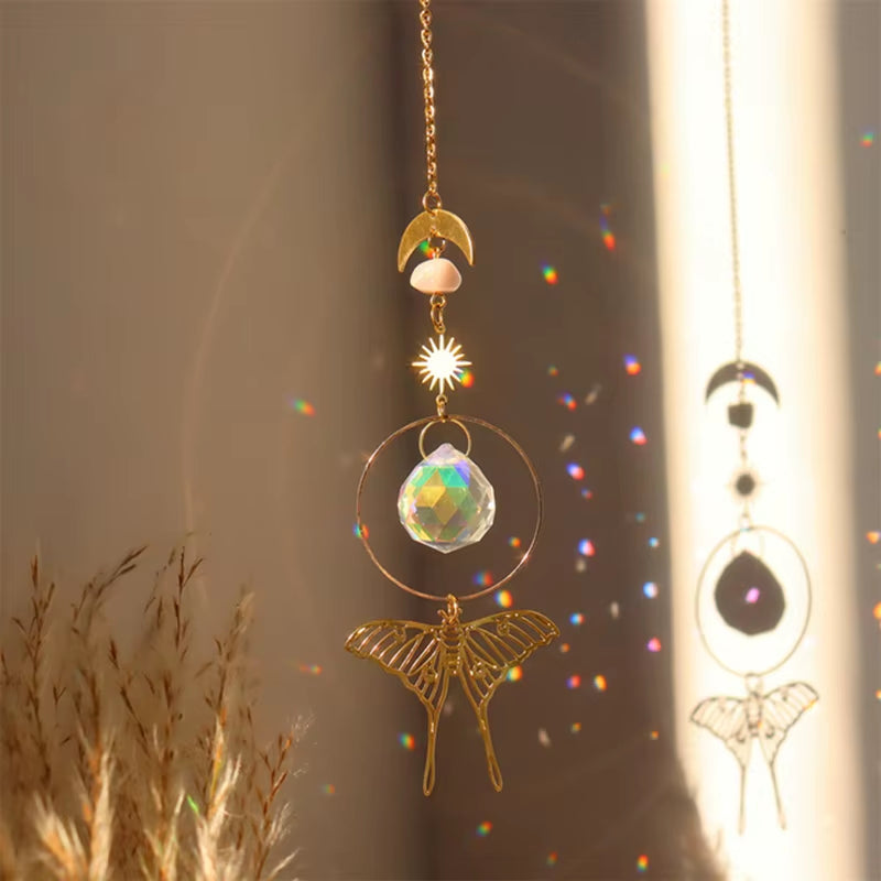 Decorative hanging crystal suncatcher featuring golden butterfly and moon design