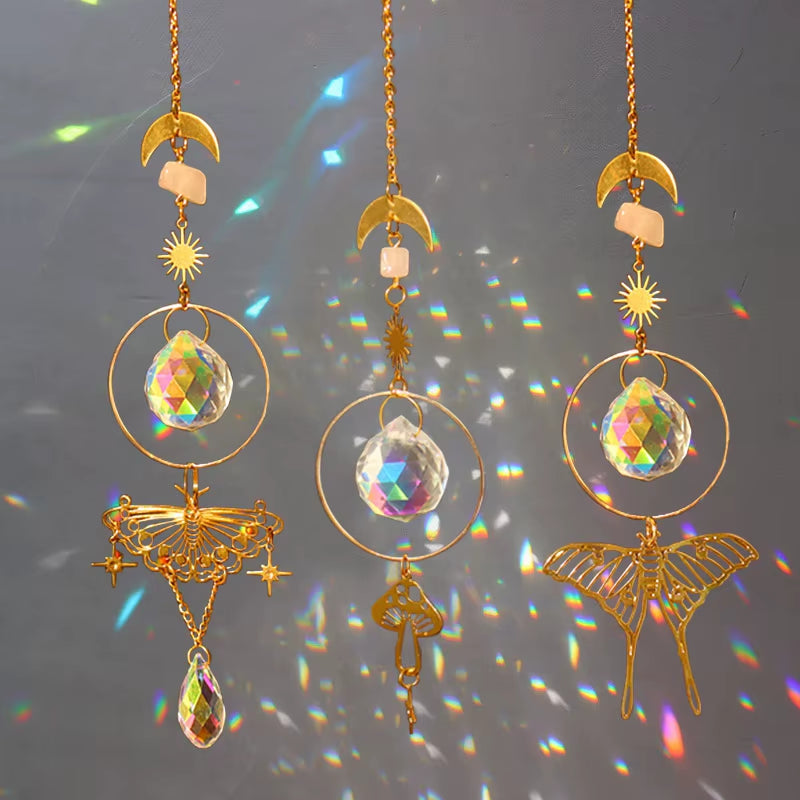 Three decorative crystal suncatchers with moons, stars, and butterflies for outdoor decor