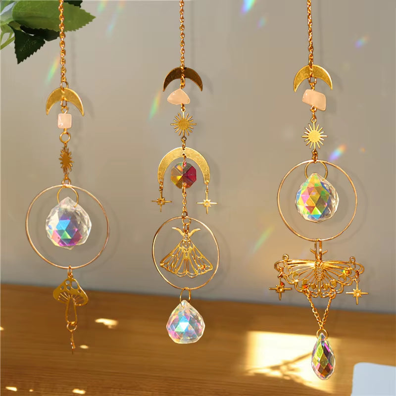 Three decorative golden sun catchers with crystals and charms for outdoor decor