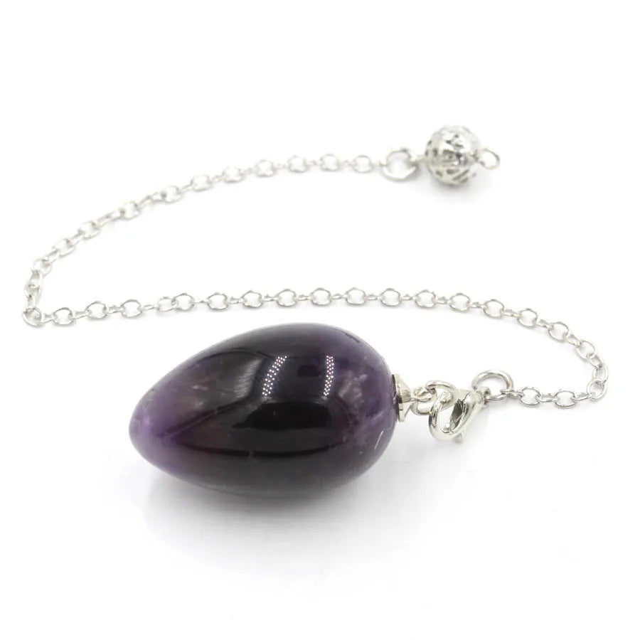 Pendule en forme d'œuf de cristal : quartz rose et plus