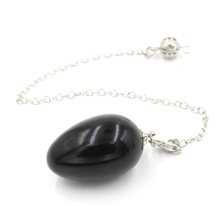 Pendule en forme d'œuf de cristal : quartz rose et plus