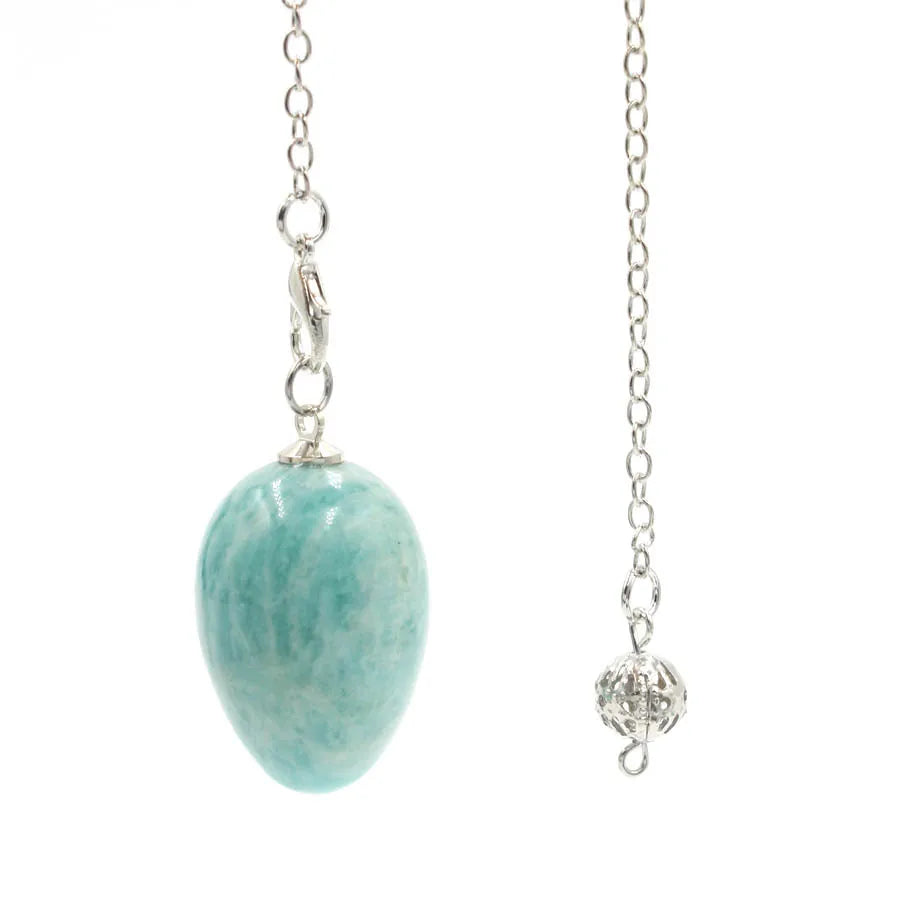 Pendule en forme d'œuf de cristal : quartz rose et plus