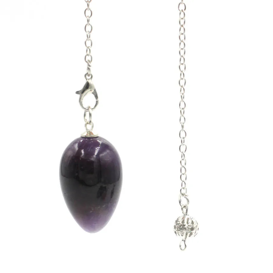 Pendule en forme d'œuf de cristal : quartz rose et plus