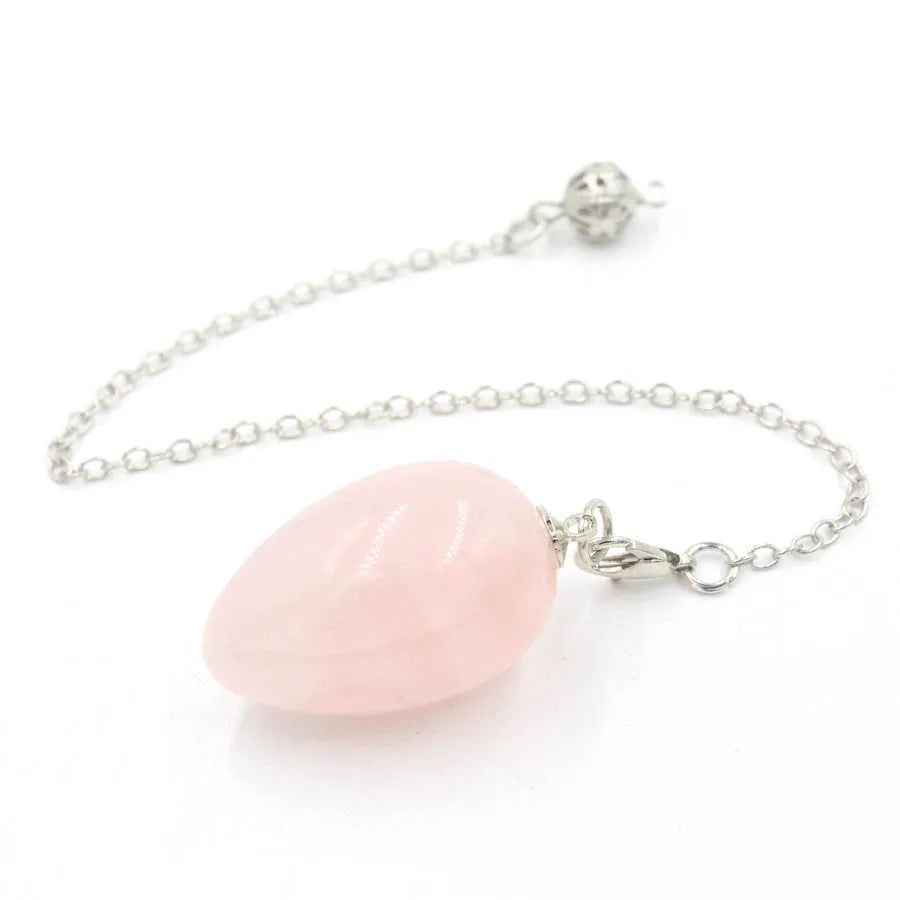 Pendule en forme d'œuf de cristal : quartz rose et plus