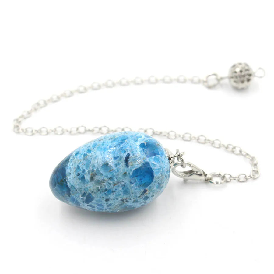 Pendule en forme d'œuf de cristal : quartz rose et plus