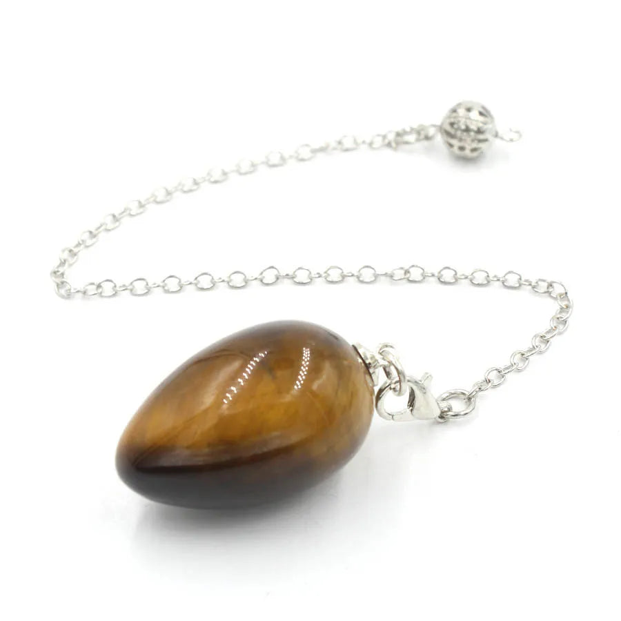 Pendule en forme d'œuf de cristal : quartz rose et plus