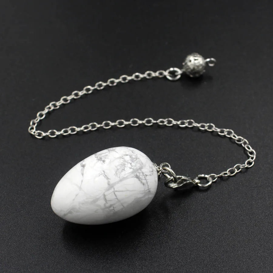 Pendule en forme d'œuf de cristal : quartz rose et plus