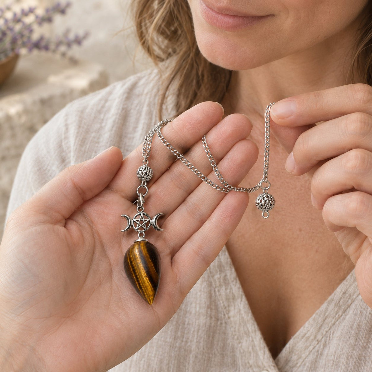 25cm Crystal Healing Pendulum for Energy & Chakra Balance, held in the hand to show its real size