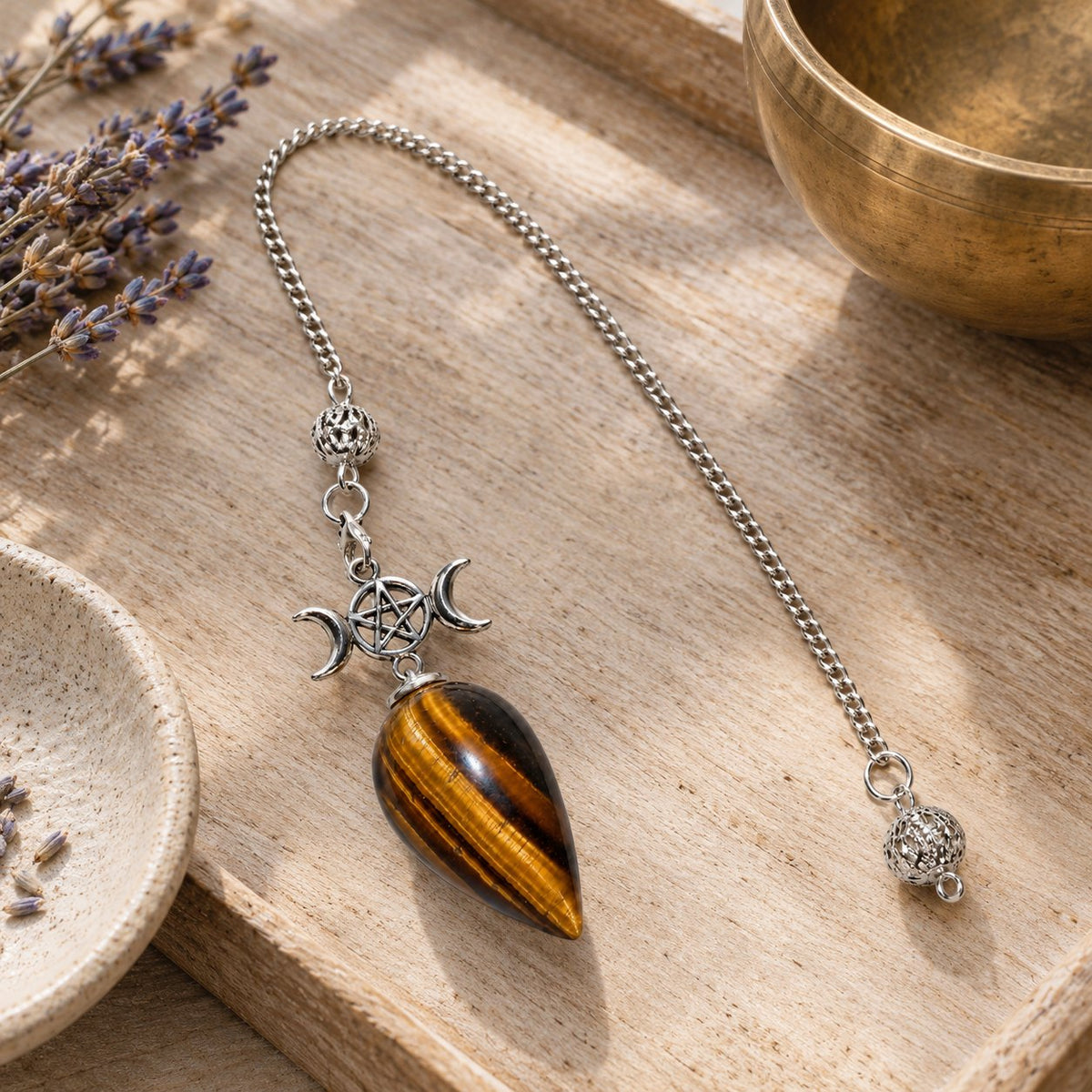 25cm Crystal Healing Pendulum for Energy & Chakra Balance, styled with a singing bowl and lavender