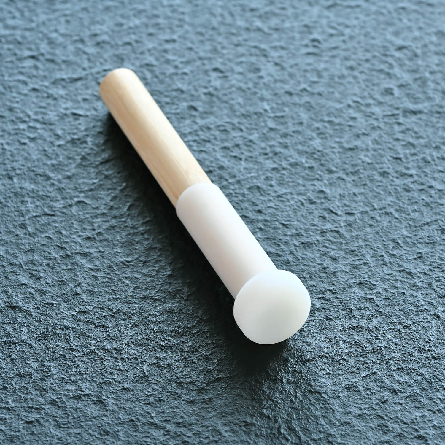 White cigarette filter with tan paper wrapping for Crystal Singing Bowl Magic Mallet
