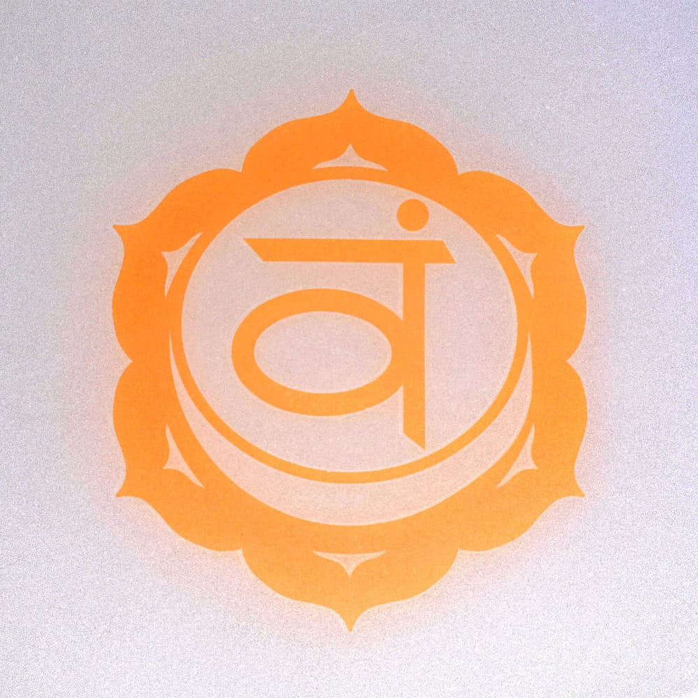 Orange sacral chakra symbol in lotus border on D Note Crystal Singing Bowl for meditation