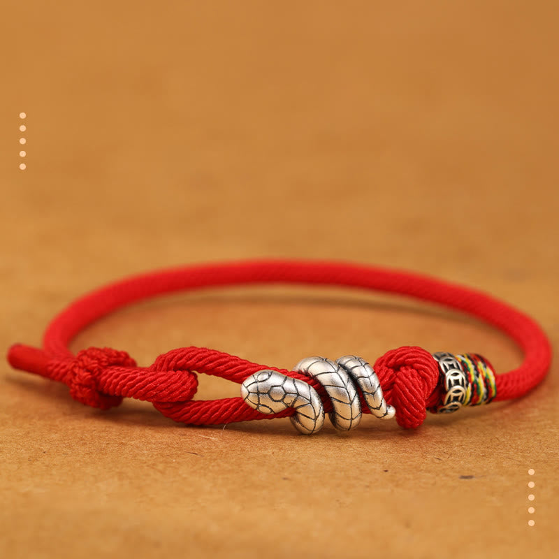Bracelet en argent sterling rouge foncé 14-17 cm avec pièce de monnaie serpent et cordon rouge